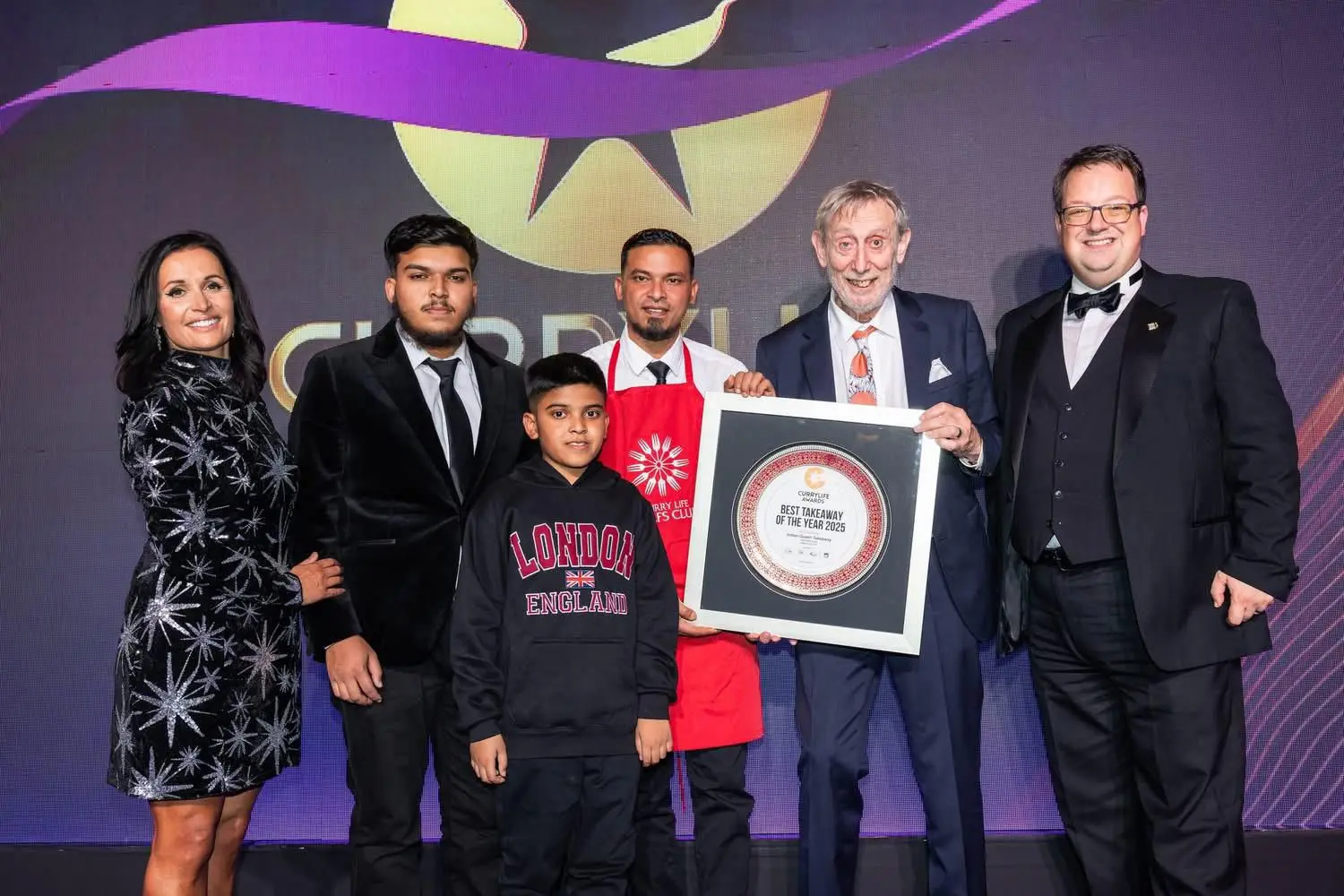 People holding Best Takeaway Award